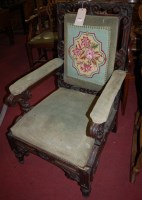 Lot 1351 - A Victorian carved oak framed and floral...