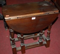 Lot 1355 - A small stained wood dropflap low occasional...