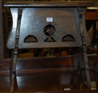 Lot 1374 - A joined oak stool, having pierced cut-out frieze