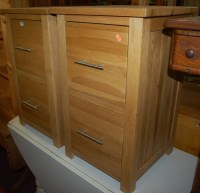 Lot 1379 - A pair of contemporary light oak two drawer...