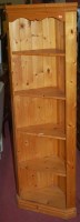 Lot 1381 - A modern pine freestanding corner shelf;...