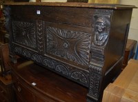 Lot 1392 - A circa 1900 low relief carved oak hinge-top...