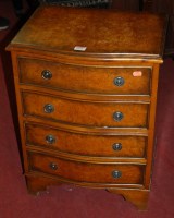 Lot 1398 - A reproduction figured walnut small serpentine...