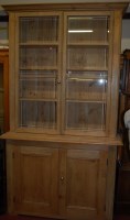 Lot 1154 - A Victorian pine bookcase cupboard of large...