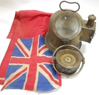 Lot 67 - A brass cased ship's compass bearing a label...
