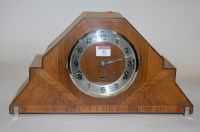 Lot 12 - An Art Deco walnut cased mantel clock having a...