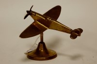 Lot 29 - A brass desk ornament in the form of a Spitfire