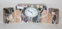 Lot 34 - An Art Deco veined marble cased three-piece...
