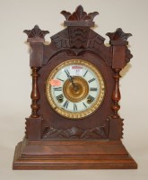Lot 57 - A late 19th century oak cased mantel clock by...