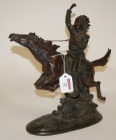 Lot 22 - A modern resin figure of a native American on...