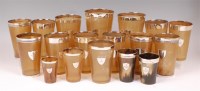 Lot 1299 - A matched suite of graduated horn beakers,...