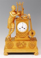 Lot 1506 - A large French Empire gilt bronze mantel clock...