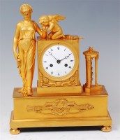 Lot 1507 - A French Empire gilt bronze mantel clock by...