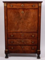 Lot 1529 - A French Empire period mahogany secrétaire à...