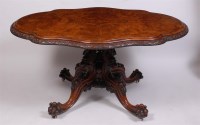 Lot 1607 - A Victorian figured walnut pedestal breakfast...