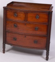 Lot 1552 - An early 19th century mahogany bowfront chest,...