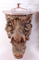 Lot 1603 - A 19th century carved limed wood wall bracket,...