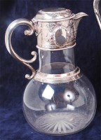 Lot 1079 - A mid-Victorian glass and silver topped claret...