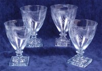 Lot 1089 - A set of four Regency glass goblets, the wheel...