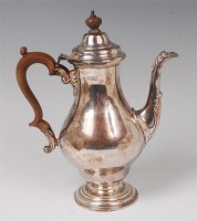 Lot 1115 - A silver pedestal coffee pot, in the early...