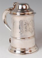 Lot 1128 - An early George III silver lidded tankard, the...