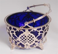 Lot 1147 - A George V silver bonbon basket, having blue...