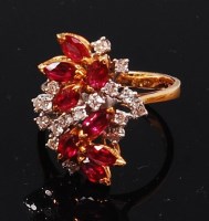 Lot 1179 - A ladies 18ct gold, ruby and white sapphire...