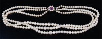 Lot 1183 - A cultured pearl triple string choker, having...
