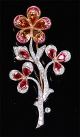 Lot 1189 - An 18ct yellow gold, ruby and diamond set...
