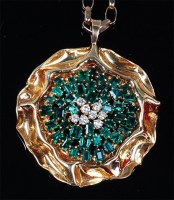 Lot 1192 - A modern 18ct gold, emerald and diamond flower...
