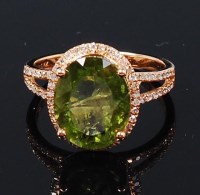 Lot 1198 - A contemporary 14ct gold, green peridot and...