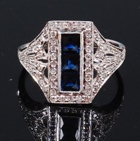 Lot 1199 - An Art Deco style white metal, sapphire and...