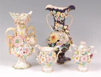 Lot 1058 - An English porcelain floral encrusted pedestal...