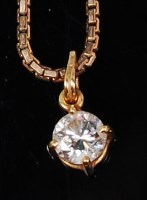 Lot 1221 - A contemporary diamond pendant, the four claw...