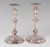 Lot 1113 - A pair of early Georgian silver candlesticks,...