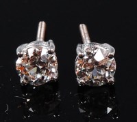 Lot 1238 - A pair of 18ct white gold and diamond set ear...