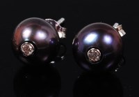Lot 1239 - A pair of black pearl and diamond set ear...