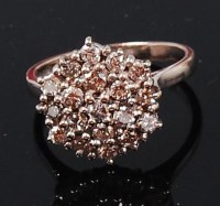 Lot 1244 - An 18ct white gold diamond cluster ring,...