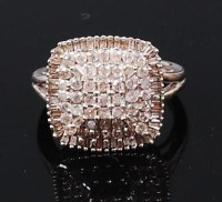 Lot 1245 - A contemporary 9ct gold diamond cluster ring,...