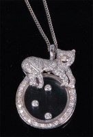 Lot 1258 - A Chopard style 'happy diamonds' pendant, on...