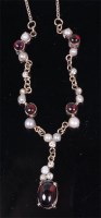 Lot 1259 - A 9ct gold necklet, set with cabochon garnets,...