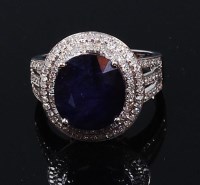 Lot 1261 - A contemporary 14ct white gold, sapphire and...
