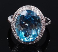 Lot 1263 - A contemporary 14ct white gold, blue topaz and...