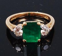 Lot 1267 - An 18ct gold, emerald and diamond ring, the...