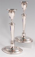 Lot 1148 - A pair of Edwardian silver candlesticks, of...