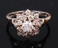 Lot 1286 - An 18ct white gold and diamond cluster ring,...