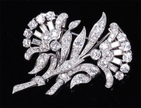 Lot 1188 - A white metal and diamond set leaf and flower...