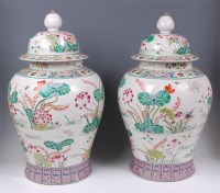 Lot 1372 - A pair of Chinese famille rose vases and...