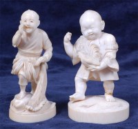 Lot 1409 - A Japanese carved ivory netsuke of a fisherman,...