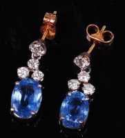 Lot 1255 - A pair of sapphire and diamond ear studs, the...